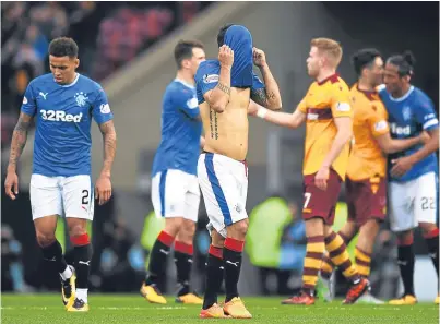  ?? Picture: SNS Group. ?? Dejection for the Rangers players at the final whistle in Sunday’s cup tie.