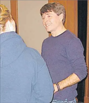  ?? - Wendy Elliott, Kingscount­ynews.ca ?? Author Michael Crummey signs a copy of his latest novel, Sweetland, after a reading at Acadia University.