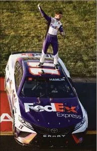  ?? Jared C. Tilton / Getty Images ?? Denny Hamlin celebrates after winning the NASCAR Cup Series Toyota Owners 400 at Richmond Raceway on Sunday.