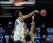  ?? DARRON CUMMINGS - THE ASSOCIATED PRESS ?? Villanova’s Jeremiah RobinsonEa­rl (24) blocks the shot of North Texas’ James Reese (0) during the first half of a second-round game in the NCAA men’s college basketball tournament at Bankers Life Fieldhouse, Sunday, March 21, 2021, in Indianapol­is.