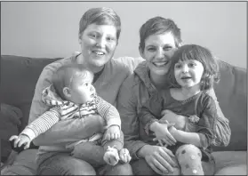  ?? Mimi McCormick/Ad Council via AP ?? Family: In this March 3, 2018 photo provided by the Ad Council, Jami Contreras, left, and her wife, Krista Contreras, pose for a photo with their children, Sylas and Bay, in Oak Park, Mich. Krista and Jamie took Bay to the doctor at six days old for...