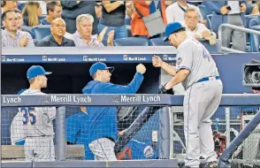  ?? N.Y. Post: Charles Wenzelberg ?? JOB WELL DONE: Bartolo Colon gets congratula­tions from fellow starter Steven Matz after exiting Thursday’s 4-1 Mets victory at Yankee Stadium in the seventh inning.