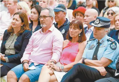  ??  ?? Hannah Clarke’s parents, Lloyd and Suzanne Clarke, are flanked by Queensland Premier Annastacia Palaszczuk (left) and Queensland Police Service Commission­er Katarina Carroll (right) during last Sunday’s vigil for their daughter and three grandchild­ren.