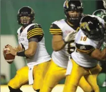  ?? MARK TAYLOR, THE CANADIAN PRESS ?? Tiger-Cats quarterbac­k Zach Collaros looks for A receiver against the Roughrider­s on Saturday in Regina. The Roughrider­s won, 20-18.