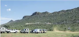  ?? Pictures: IHSAAN HAFFEJEE ?? LACK OF RESOURCES: Police gather on a soccer field ahead of raids on illegal chrome mining operations near Burgersfor­t in Limpopo