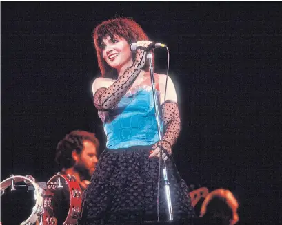  ?? PAUL NATKIN GETTY IMAGES ?? Linda Ronstadt, onstage in 1983, is long done with singing, but remembers her 1980 HBO concert — now a hit album — as truly hot.