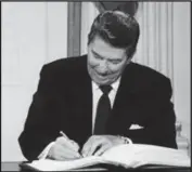  ??  ?? FACT in 1988, President Reagan signes an FHA bill that put HECM loans into law.