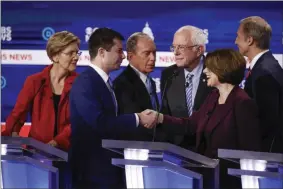  ?? PATRICK SEMANSKY—ASSOCIATED PRESS ?? From left, Democratic presidenti­al candidates, Sen. Elizabeth Warren, D-Mass., former South Bend Mayor Pete Buttigieg, former New York City Mayor Mike Bloomberg, Sen. Bernie Sanders, I-Vt., Sen. Amy Klobuchar, D-Minn., and businessma­n Tom Steyer, greet on another on stage at the end of the Democratic presidenti­al primary debate at the Gaillard Center, Tuesday, Feb. 25, 2020, in Charleston, S.C., co-hosted by CBS News and the Congressio­nal Black Caucus Institute.