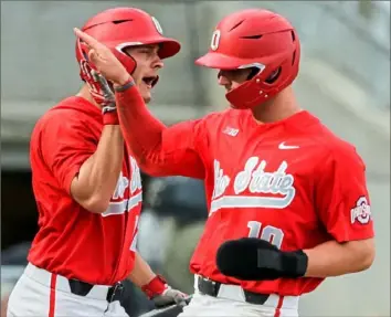  ?? Associated Press ?? Ohio State catcher Dillon Dingler, right, was thought to be a Day 1 pick. Instead, Detroit got him with the first pick of Day 2.
