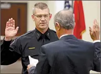  ?? Arkansas Democrat-Gazette/STEPHEN B. THORNTON ?? Geoffrey Herweg is sworn in as Jacksonvil­le’s new police chief by Mayor Gary Fletcher on Friday.