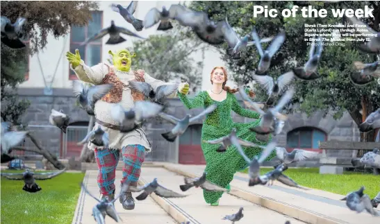  ?? Shrek The Musical Photo / Michael Craig ?? Shrek (Tom Knowles) and Fiona (Karla Lyford) run through Aotea Square where they will be performing in from July 12.