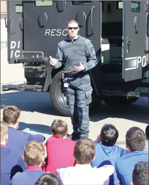  ??  ?? Students at St. Anne’s were visited officers from the Lodi Police Department and were able to see the B.A.T.T. (Ballistics Armored Tactical Transport) vehicle.