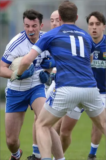  ??  ?? Conor Morgan, Dundalk Gaels is challenged by Darren Clarke and Ronan Carroll, Ardee St. Mary’s.