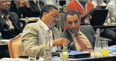  ?? Picture: RIAAN MARAIS ?? FOCUS ON SKILLS: Rural Developmen­t and Agrarian Reform MEC Mlibo Qoboshiyan­e, left, and NMMU vice-chancellor Derrick Swartz at the 2017 South African Maritime Industry Conference held at The Boardwalk in Port Elizabeth yesterday