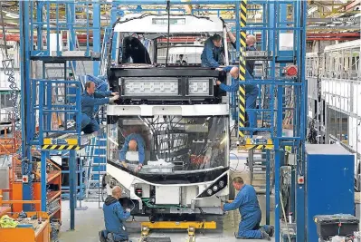  ?? Picture: PA. ?? The production line at Alexander Dennis’s Scottish bus factory.