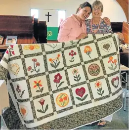  ??  ?? FETED TO WIN: Port Alfred Methodist Church recently held a fete and wishes to thank the community for their support. First prize in their raffle, won by Bronwyn Dorrington, left, was a beautiful hand-made quilt made by Di Long