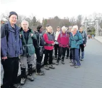  ??  ?? ●● Ramblers on Queens Park Footbridge crossing the Dee