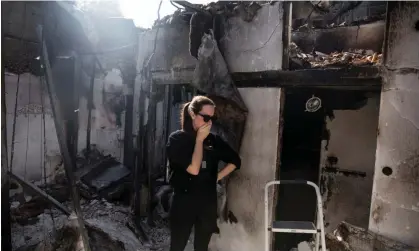  ?? ?? Inbar Goldstein visits her parents' house for the first time after it was burnt in Hamas's attack on Israel on 7 October. Photograph: Amir Levy/Getty Images