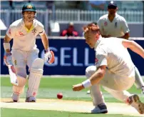  ?? AFP ?? David Warner was caught off debutant Tom Curran (right) at 99 but England’s bowler had oversteppe­d, giving the Australian opener an opportunit­y to complete his 21st century. —