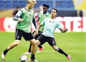  ?? AP PHOTO ?? Ajax’s Justin Kluivert (right) goes for the ball with Kasper Dolberg during a training session at the Friends Arena in Stockholm yesterday.