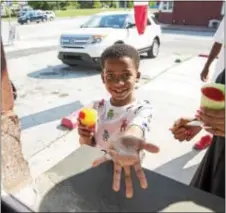  ?? RICK KAUFFMAN – DIGITAL FIRST MEDIA ?? Jackson McNear, 7, was stoked on his flavor choice and wanted another outside May’s Water Ice.