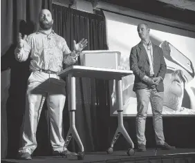  ?? STAFF PHOTO BY ANGELA LEWIS FOSTER ?? Reed Hayes, left, and Dennis Lally make their pitch for their company, Rendever, Wednesday at Gigtank 365’s Pitch Night at the Edney Innovation Center.