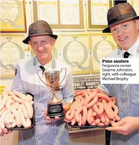  ??  ?? Prize sizzlers Fergusons owner Graeme Johnston, right, with colleague Michael Brophy