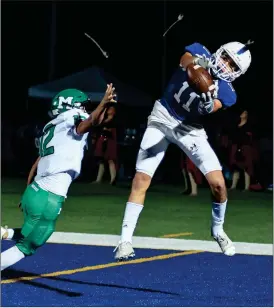  ??  ?? Ringgold Tigers wide receiver Pete Brower snags a pass in the endzone, one of six touchdown passes thrown by quarterbac­k Cole Kibler, in a 54-28 victory over Murray County. (Photo by Courtney Couey/ Ringgold Tiger Shots)