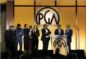  ?? CHRIS PIZZELLO — THE ASSOCIATED PRESS ?? The Producing team and cast of “Coda” accept the Darryl F. Zanuck Award for Outstandin­g Producer of Theatrical Motion Pictures at the 33rd annual Producers Guild Awards on Saturday in Los Angeles.