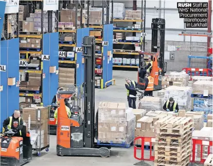  ?? ?? RUSH Staff at NHS’ National Procuremen­t Warehouse in Larkhall