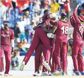  ??  ?? Windies players celebratin­g a wicket.