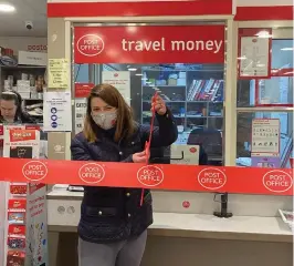  ??  ?? Burnham Conservati­ve MP Joy Morrissey cuts the ribbon at the village's new Post Office and Budgens store.