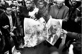  ?? MOHAMMED ABED/GETTY-AFP ?? Palestinia­ns burn images of President Trump and Prime Minister Benjamin Netanyahu.