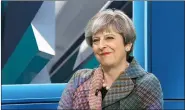  ??  ?? Theresa May in Vivienne Westward tartan patchwork jacket.