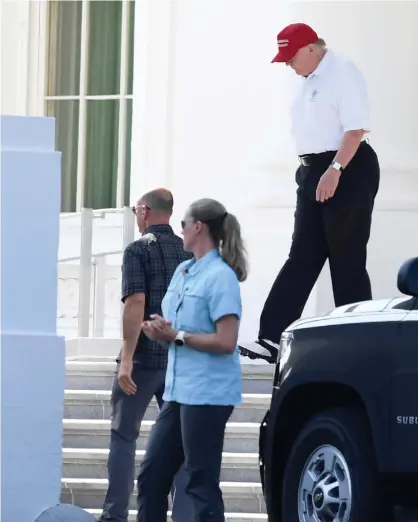  ?? Photograph: Mike Theiler/Reuters ?? Donald Trump, in golf attire, departs the White House for the drive to his Trump National Gold Club in Sterling, Virginia, on Sunday.