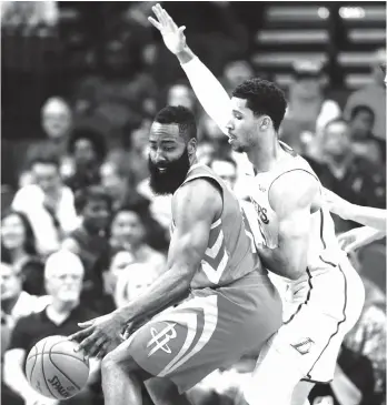  ?? AP Photo ?? HOUSTON ROCKETS guard James Harden (13) backs into Los Angeles Lakers guard Josh Hart (5) in the first half of an NBA basketball game Wednesday, Dec. 20, 2017, in Houston.