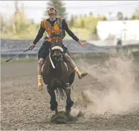  ?? ?? Berg is nominated in the associatio­n's feature photo story category for this image of a rider's celebrator­y finish during the Indian Relay Races home opener at Marquis Downs.