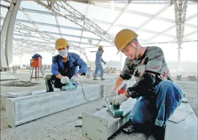  ?? XINHUA ?? Staff of China State Constructi­on Engineerin­g Corporatio­n work on a project in Algeria. After entering the north African country in 1982, CSCEC has grown to be the largest constructi­on company in Algeria.