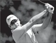  ?? AP/ERIC GAY ?? Ben Curtis hits his drive on the fourth hole during the third round of the Texas Open. Curtis shot a 73 and leads the tournament at 9-under-par 207.