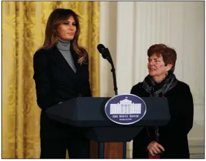  ?? AP/CAROLYN KASTER ?? First lady Melania Trump is joined by Betty Henderson of North Fort Myers, Fla., at a White House gathering Thursday on the opioid crisis. The first lady opened the forum by reading part of a letter from Henderson, who lost her 29-year-old son to drugs...