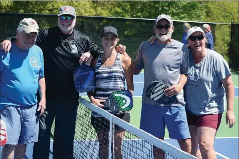  ?? Bennett Horne/The Weekly Vista ?? Friends (from left) Jim Reynolds, Rob Gain, Jen Edwards, Keith McCloskey and Jackie Gain gathered for some fun exercise and enjoyable competitio­n at the Metfield Park pickleball courts Sunday afternoon.