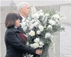  ?? AP ?? US Vice-President Mike Pence and his wife Karen lay a wreath during a visit to the former Nazi concentrat­ion camp in Dachau, Germany, on Sunday.