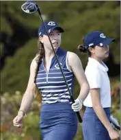  ?? The Maui News
MATTHEW THAYER photos ?? LEFT PHOTO:
First-round leader Madison Wood of UC Davis watches her drive on the third hole.