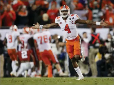  ?? JOHN BAZEMORE — THE ASSOCIATED PRESS ?? In this file photo, Clemson’s Deshaun Watson celebrates a last second game-winning touchdown pass to Hunter Renfrow in the second half of the NCAA college football playoff championsh­ip game against Alabama in Tampa, Fla.