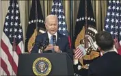  ?? Kent Nishimura Los Angeles Times ?? PRESIDENT Biden responds to a reporter’s question during a news conference at the White House Nov. 9.