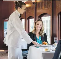  ?? HERITAGE PARK ?? A three-course, two-hour meal is served in a gleaming vintage railway car as it’s pulled by an antique steam engine around Calgary’s sprawling Heritage Park.