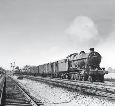 ?? Kiddermins­ter Railway Museum Collection ?? In September 1951 ‘4700’ class 2-8-0 No 4703 passes through Wantage Road station with an up goods. The fitted freight work ran six-days-aweek, but at the height of summer and the operationa­l stresses that summer passenger operation brought about, the ‘4700s’ found themselves able to step in on such work. No 4703 was new in March 1922 to Stafford Road shed, but at nationalis­ation it was at Laira. It became a St Phillips Marsh stalwart in the 1950s, being on hand by August 1950 and not being moved away, to Southall, until autumn 1962. Its lifetime mileage of 1,651,245 was noted upon withdrawal from Old Oak Common, with No 4707 on 11 May 1964 as the last members of the class; both were scrapped by A King & Sons of Norwich.