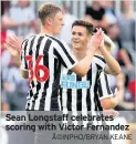  ??  ?? Sean Longstaff celebrates scoring with Victor Fernandez