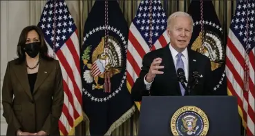  ?? SAMUEL CORUM / GETTY IMAGES ?? President Biden speaks alongside Vice President Kamala Harris during a press conference in the State Dining Room at the White House in Washington, D.C, on Saturday. He was speaking after his infrastruc­ture bill was finally passed in the House of Representa­tives after negotiatio­ns with lawmakers on Capitol Hill went late into the night.