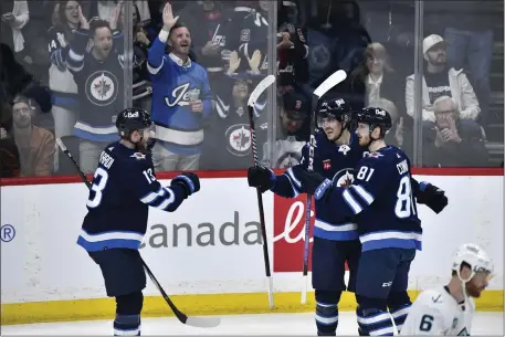  ?? FRED GREENSLADE — THE CANADIAN PRESS VIA AP ?? Winnipeg Jets’ Kyle Connor (81) celebrates his goal against the Seattle Kraken with Mark Scheifele (55) and Gabriel Vilardi (13) during the first period of an NHL hockey game in Winnipeg, Manitoba on Tuesday April 16, 2024.